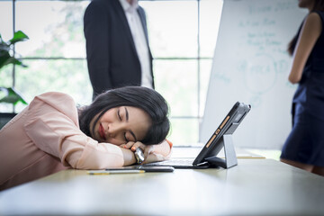 Tired businessman sleeping in a meeting conference in office ,  business team people looking...