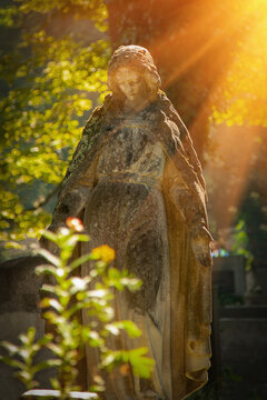 Very ancient statue of Virgin Mary. Vertical image.