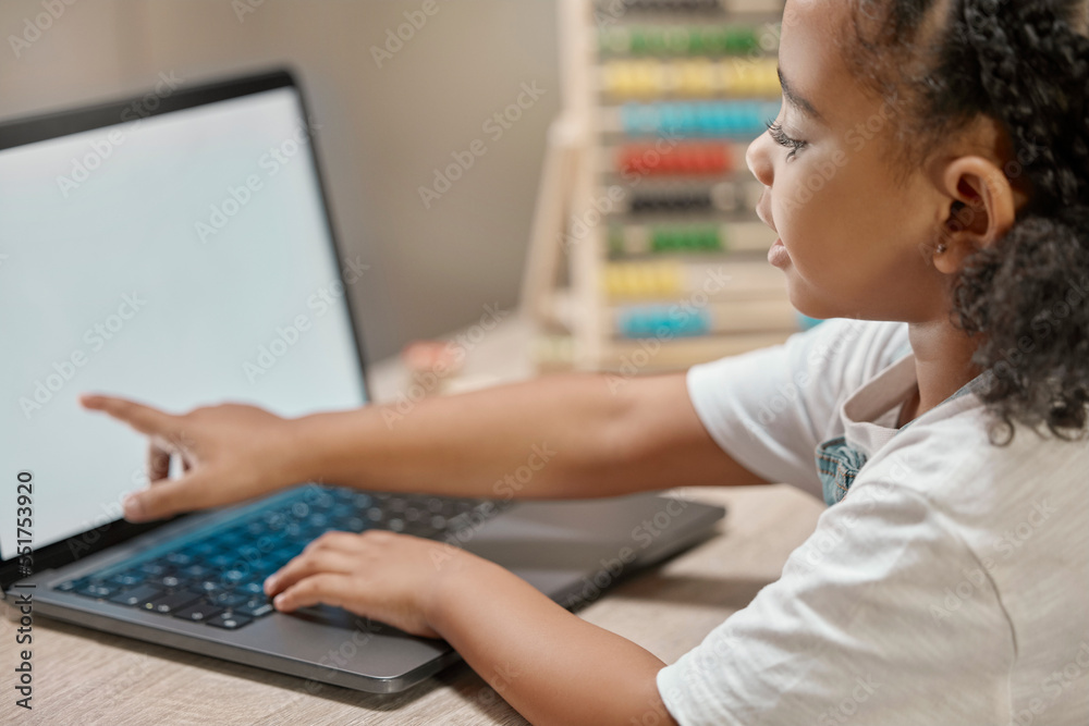 Poster girl learning, home and laptop for reading, study and e-learning at desk with blurred background. af