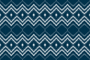 Ethnic ikat seamless pattern in tribal. Aztec geometric ethnic ornament print. Ikat pattern style. Design for background, wallpaper, illustration, fabric, clothing, carpet, textile, batik, embroidery.