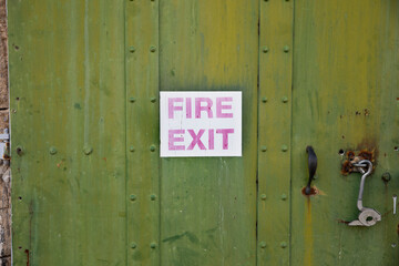 old faded fire exit sign
