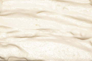 Cream texture for face and body skin care. White lotion, moisturizer, skin care cosmetics application background.