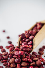 dry aromatic sumac spice on a white background