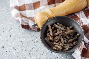 dried fragrant pippali long pepper on a stone background