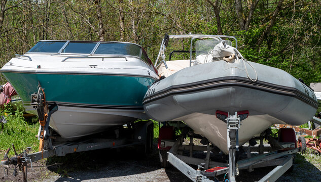 Two Motor Boats On Trailers At Parking