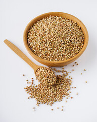 organic raw green buckwheat on a white background