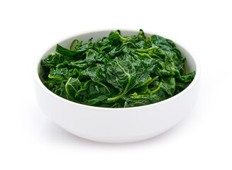 pile of green cook leaf spinach in white bowl isolated on white background. leaves spinach or heap of spinach isolated                                                    