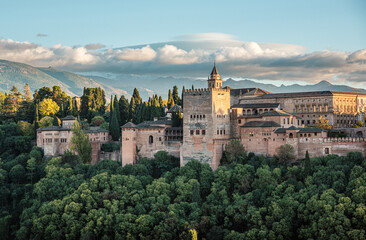Fototapeta na wymiar Alhambra the arabic castle in Granada, Andalucia, Spain - Sierra Nevada mountains in background. Seen from plaza de San Nicolas Albaycin