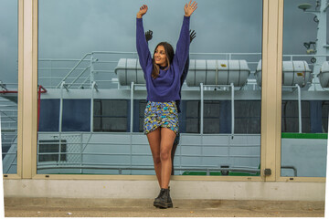 free happy girl with arms raised outside