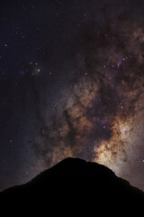 mountain silhouette and blue night sky milky way and star on dark background. universe called,nebula and galaxy with noise and grain. 