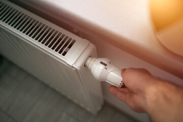 Decreasing radiator heat. Saving energy in winter. Concept of a tips list to have lower utility...
