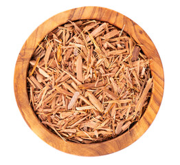 Catuaba bark in wooden bowl, isolated on white background. Trichilia catigua bark. Chuchuhuasha, Tatuaba, Pau de Reposta, Piratancara and Caramuru. Top view.