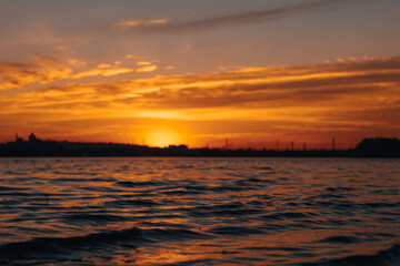 Beautiful sunset or dawn sky over the city. Dnipro.Ukraine. Background picture. Dramatic evening cloudy landscape in the city.Ukrainian city. View of the left bank. River Dnepr