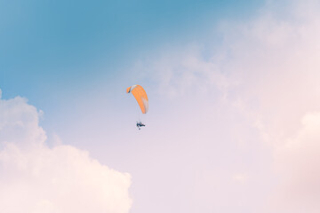 Motor Paraglider flying over sky of Ho Chi Minh City, Vietnam during New Year Festival and National Day
