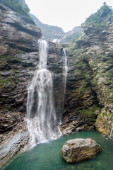 Fototapeta na wymiar The famous Sandiquan Waterfall in Lushan Mountain, Jiujiang City, Jiangxi Province, China, has the reputation of 