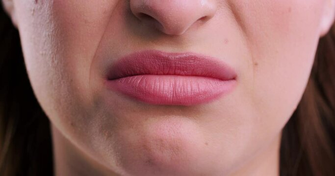 Emotional woman seeing something disgusting, closeup view of lips. Facial expression