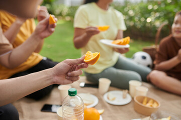 Family Eating Fresh Oranges