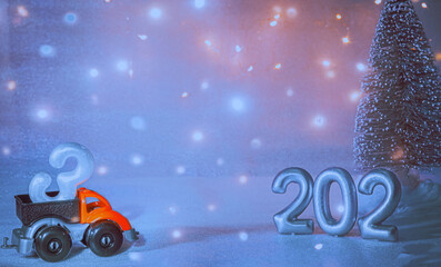 New year 2023. Christmas. Toy car with the number 3 in the back