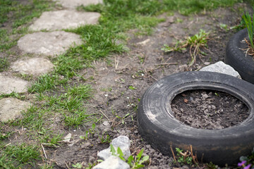 Photo of a path made of stone and tires from a car on the floor