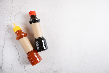 Soy and sweet and sour sauces for cooking Asian cuisine. Sauce in bottles for label design.