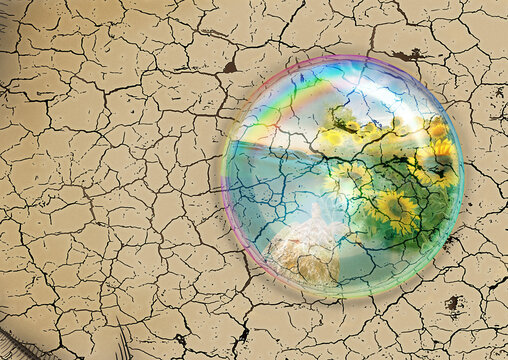 water drop with reflected images on cracked earth background