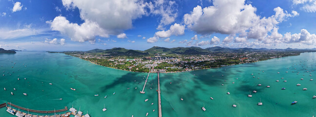 Panorama Chalong pier with sailboats and other boats at the sea,Beautiful image for travel and tour website design,Amazing phuket island view from drone panoramic landscape,Summer day time - obrazy, fototapety, plakaty