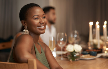Dinner, party and thinking with a black woman at a table in celebration of the new year or a birthday. Event, idea and social with a young female sitting in a home or house for the festive season