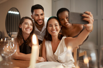 Obraz premium Friends, phone selfie and dinner party, social media and communication in home for new year celebration and happy smile. Diversity and picture for internet post at night or holiday event with group