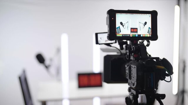 Professional camera recording podcast studio broadcasting on white background 4K