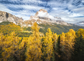 Aerial view of Tofana with yellow larches on the foreground. Cortina d'Ampezzo, Belluno province, Veneto, Italy.