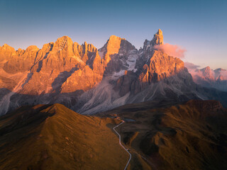 Pale di San Martino mountains during sunset. Aerial view. Rolle Pass, Trento Province, South Tyrol, Italy. - 551780329