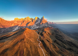 Pale di San Martino mountains during sunset. Aerial view. Rolle Pass, Trento Province, South Tyrol, Italy. - 551780551