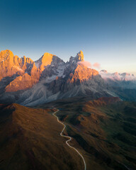 Pale di San Martino mountains during sunset. Aerial view. Rolle Pass, Trento Province, South Tyrol, Italy. - 551780553