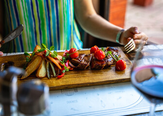 Person eating a steak.