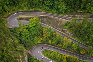 Fototapeta premium Bicaz pass mountain road high up in the Carpathian Mountains in Romania on a foggy autumn day