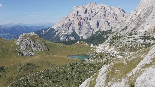 Mountain lake surrounded by tall mountain peaks. Valparola pass in Alta Badia valley, Dolomites