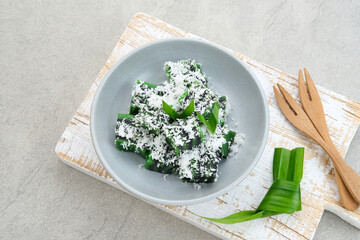 Kue Jongkong layer cake with grated coconut, Indonesian traditional snack
