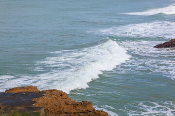 waves crashing on rocks