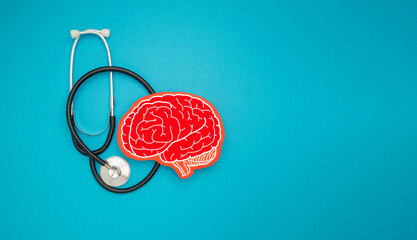 A brain shape symbol and a stethoscope on a blue background - obrazy, fototapety, plakaty