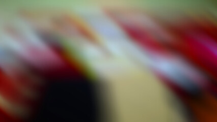Abstract blurred background with a mix of red, white, and black.