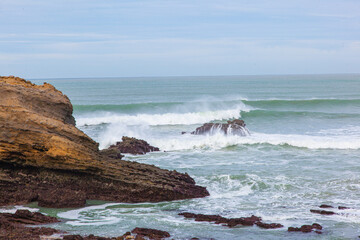 waves crashing on rocks