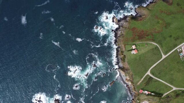 cliffs with waves, filmed from above with the drone, in lanzada in galicia in northern spain on the atlantic ocean