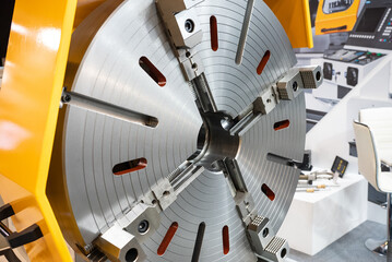 Big turning chuck with four jaws. Turning machine with big chuck.