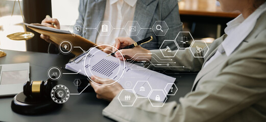 justice and law concept.Male judge in a courtroom  the gavel, working with smart phone and laptop and digital tablet computer on black table