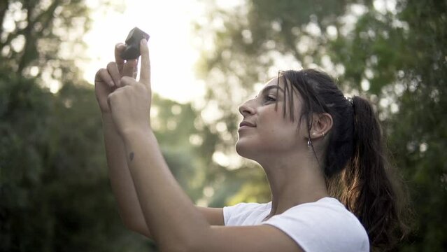 Model capturing her surroundings with a hand-held action camera