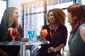 Group of friends, women and drinks for celebration, conversation or enjoy party together. Females, girls or cocktails for event, talking and have fun for happy hour, night out and relax in restaurant