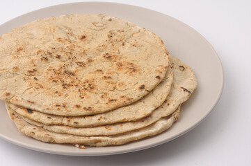 Jowar roti or Jowar bhakri in Maharashtra andis called rotla in Gujrat with ghee on top, Jowar is grain harvested in India