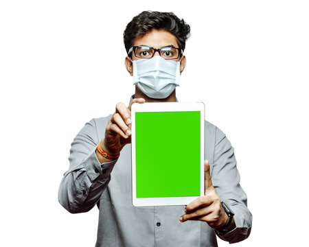 PNG of a doctor with mask displaying greenscreen tablet CGI chroma