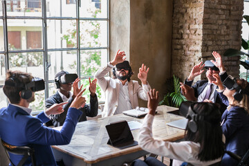 Group of business people using virtual reality to apply it in their work with benefits