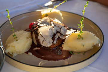Beefsteak served with fresh black truffle mushroom and balls of mashed potato in French restaurant